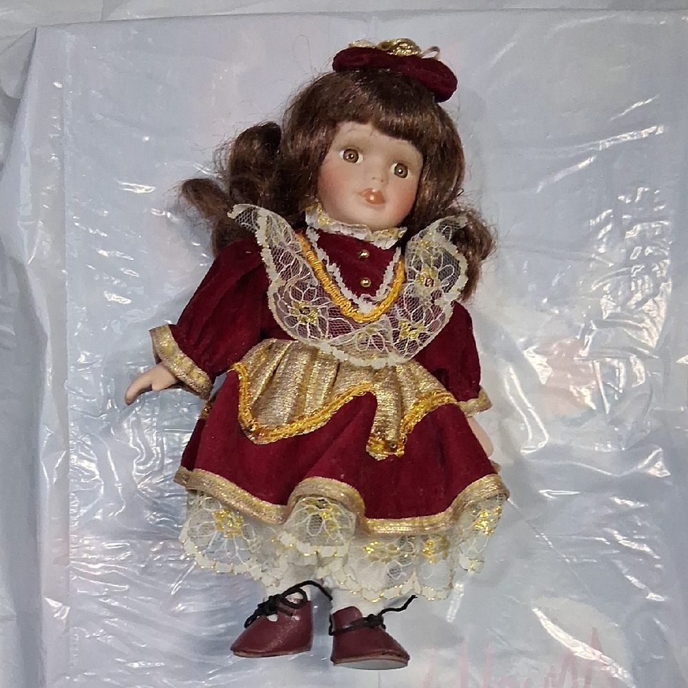 Elegant Burgundy and Gold Doll